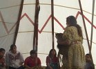 Anita talking with the children inside the tee pee.